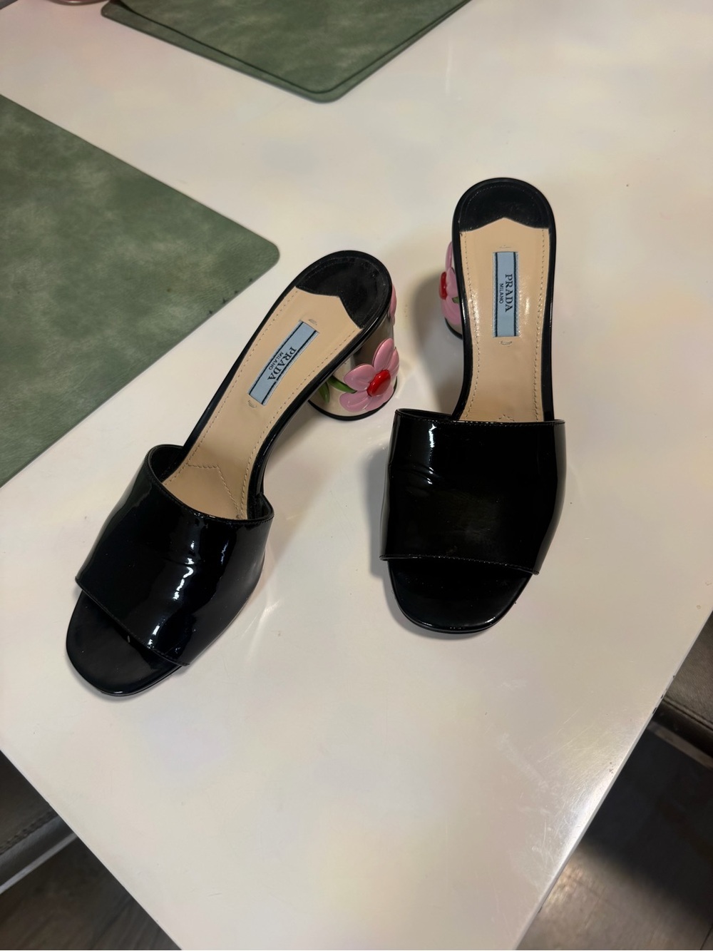 Prada Black Patent Leather Slide Mules with Floral Heel Accents